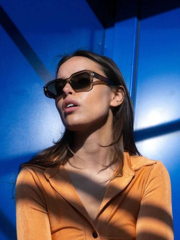 A woman wearing Meller sunglasses