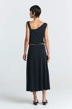 Model wearing black skirt styled for everyday use detail view