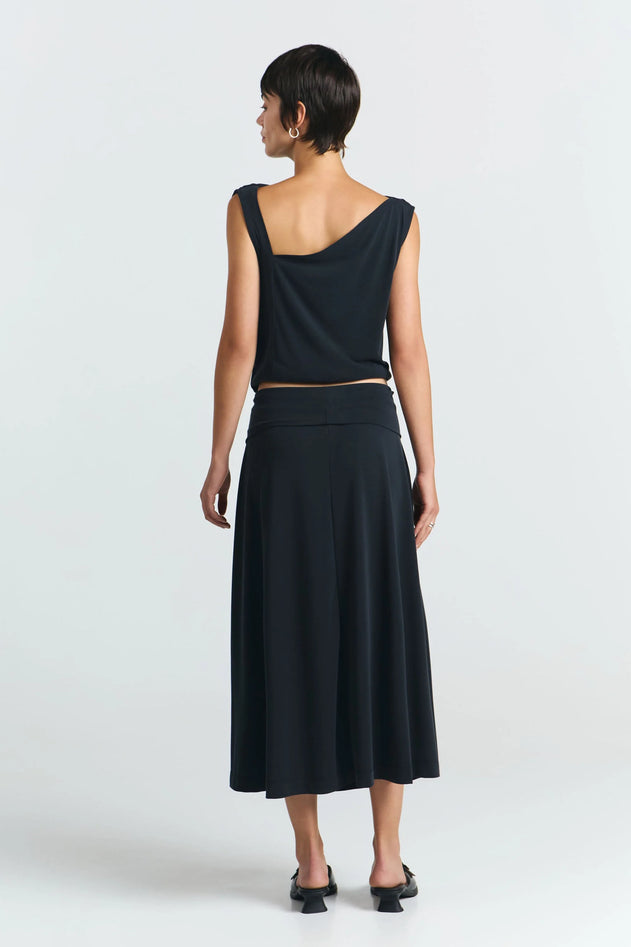 Model wearing black skirt styled for everyday use detail view