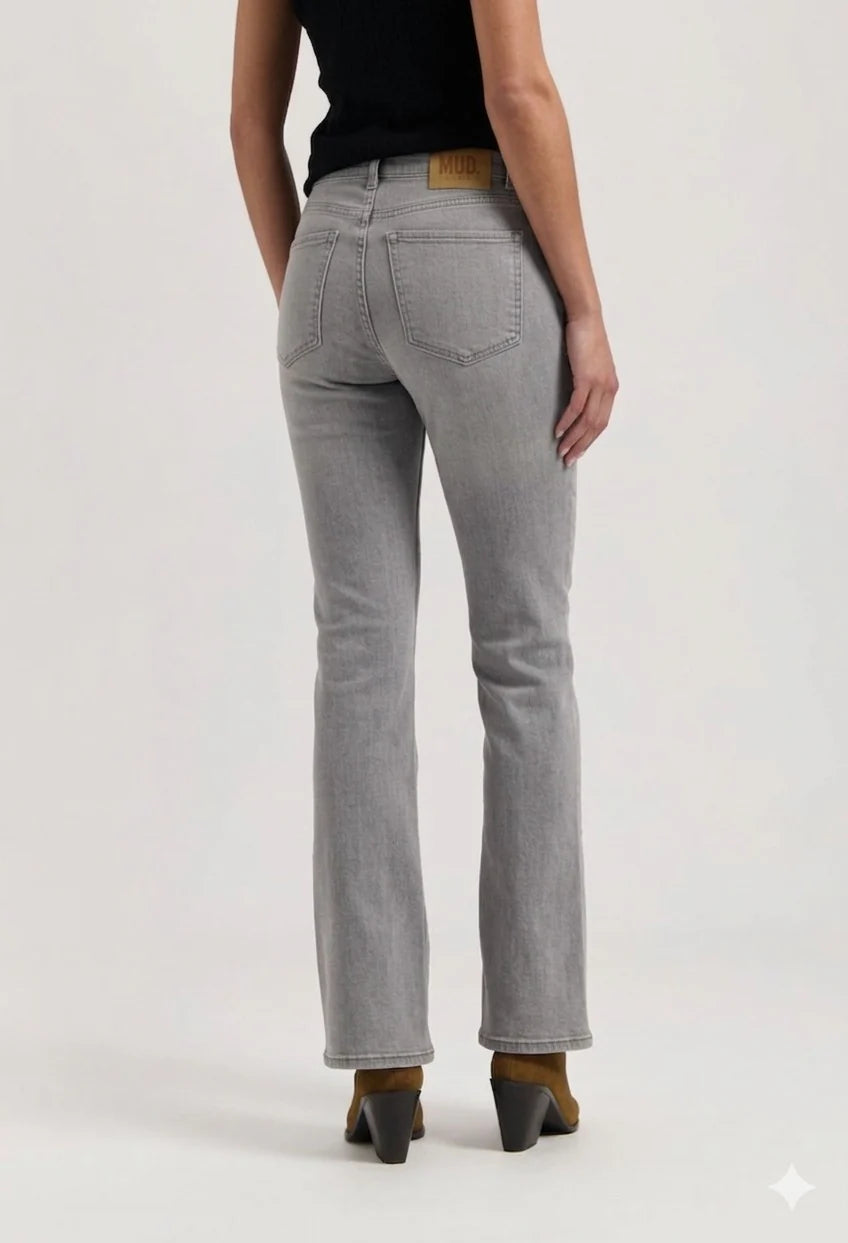 Person wearing gray jeans on a white background