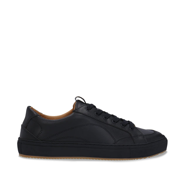 Black leather sneaker on a white background