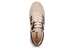Beige sneaker with brown accents on a white background
