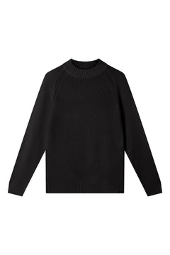 Woman wearing Komodo black merino wool sweater