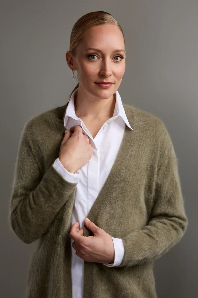 Woman wearing Original Story light olive green belted cashmere cardigan