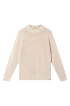 Woman wearing Komodo sand beige merino wool sweater