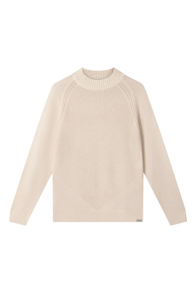 Woman wearing Komodo sand beige merino wool sweater