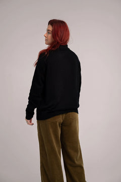 Komodo black sweater, back view