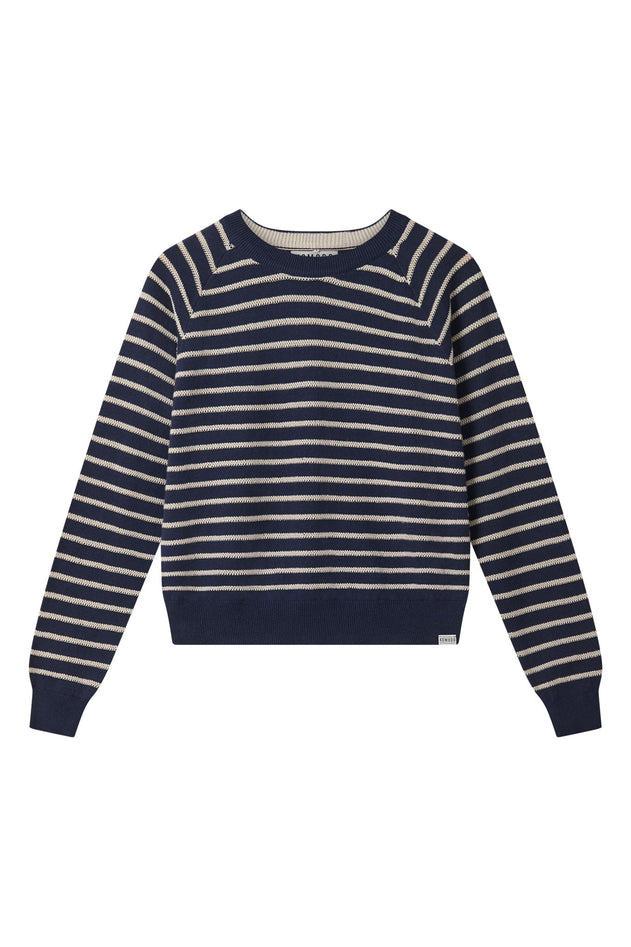 Woman wearing Komodo navy striped organic cotton jumper