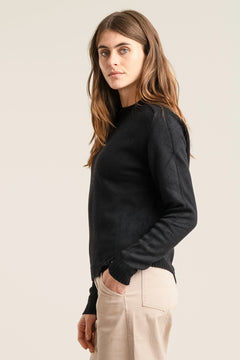 Woman wearing Komodo black merino wool sweater