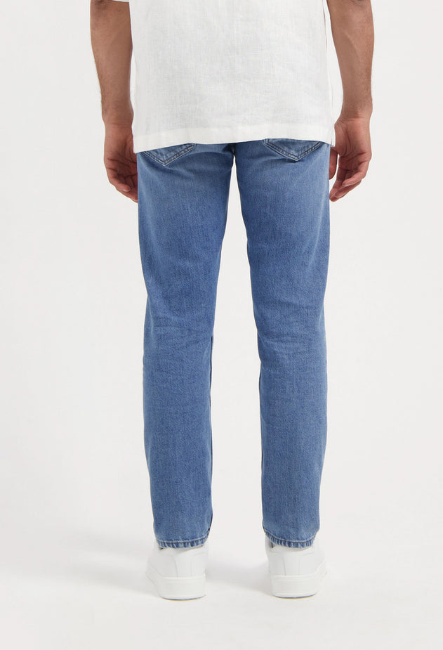 men-sustainable-jeans-hank-mid-tapered-medium-aged-half-body-back-summer.jpg?v=1758639269