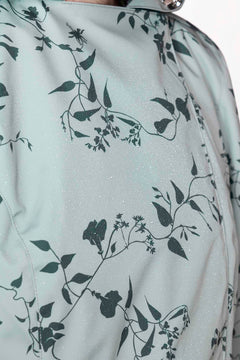 rainsisters-coat-minty-meadow-waterproof-green-floral-close-up.jpg?v=1779055013