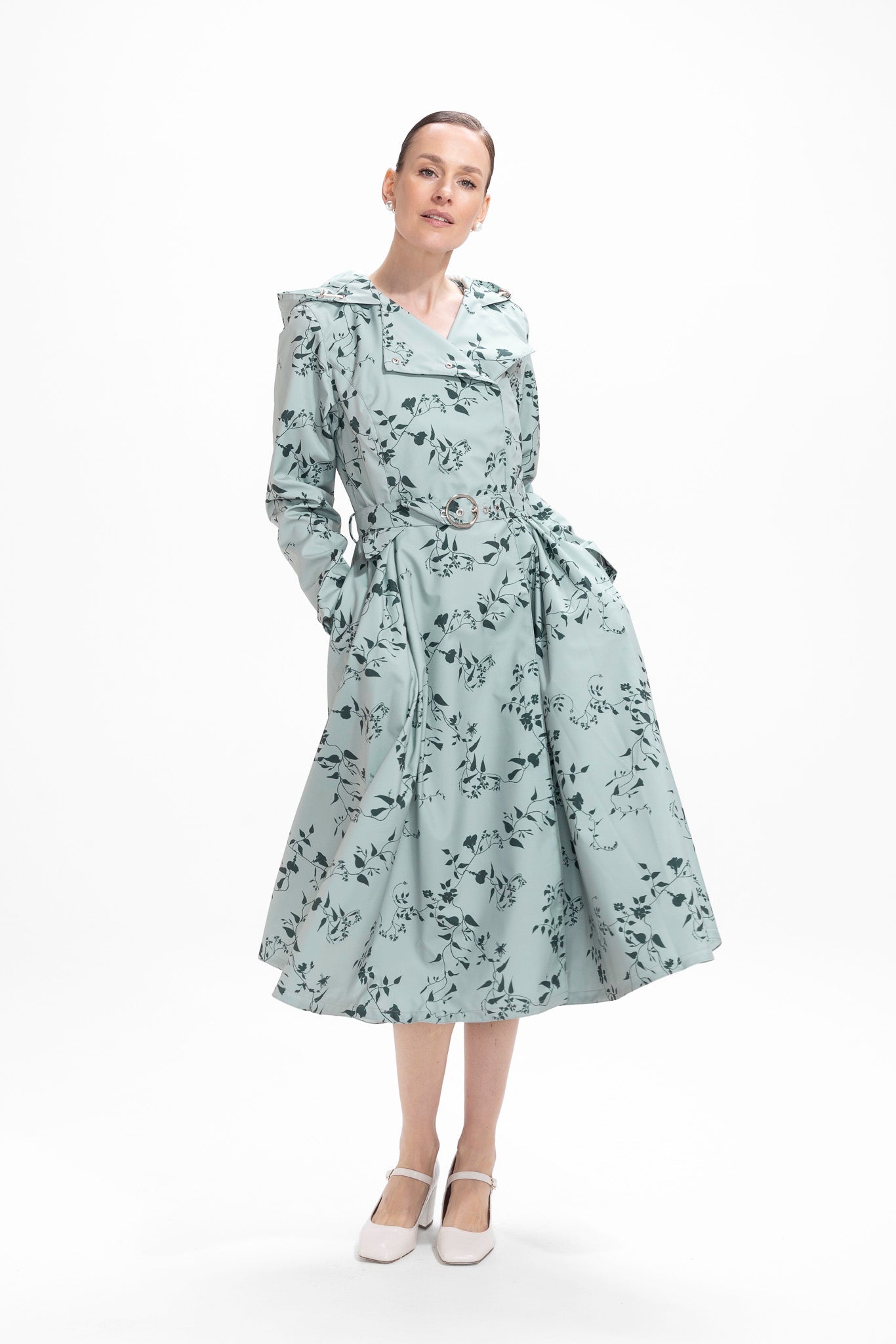 rainsisters-coat-minty-meadow-waterproof-green-floral-in-motion.jpg?v=1779055013