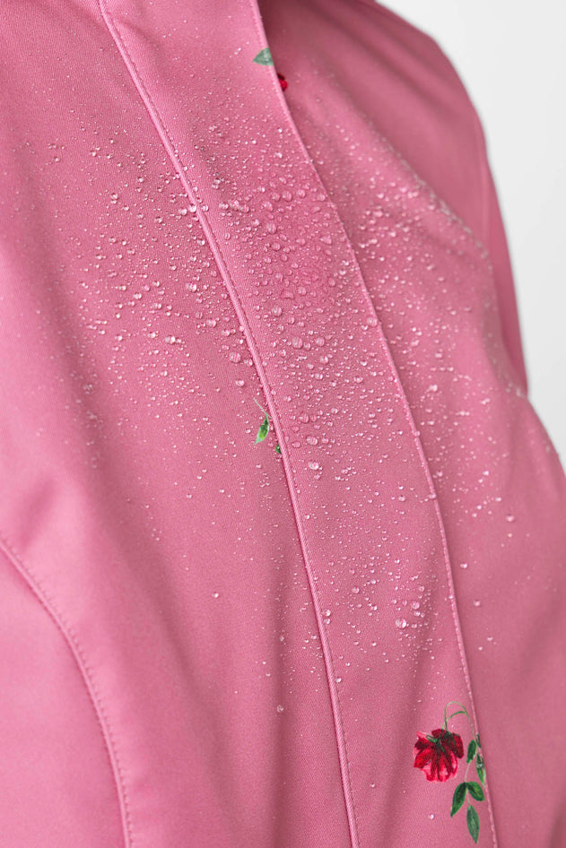 rainsisters-coat-raspberry-sorbet-waterproof-pink-floral-close-up.jpg?v=1779056642