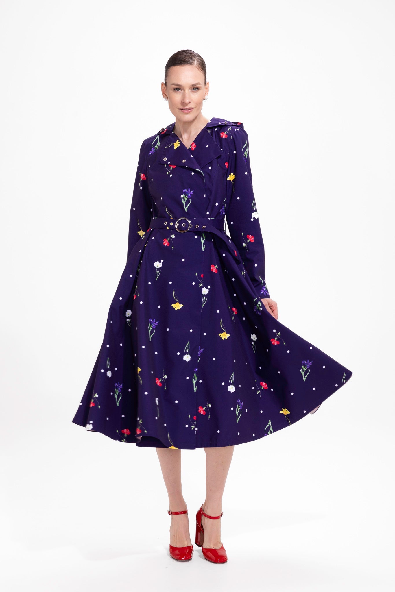 rainsisters-coat-violet-bloom-waterproof-violet-floral-in-motion.jpg?v=1779058060