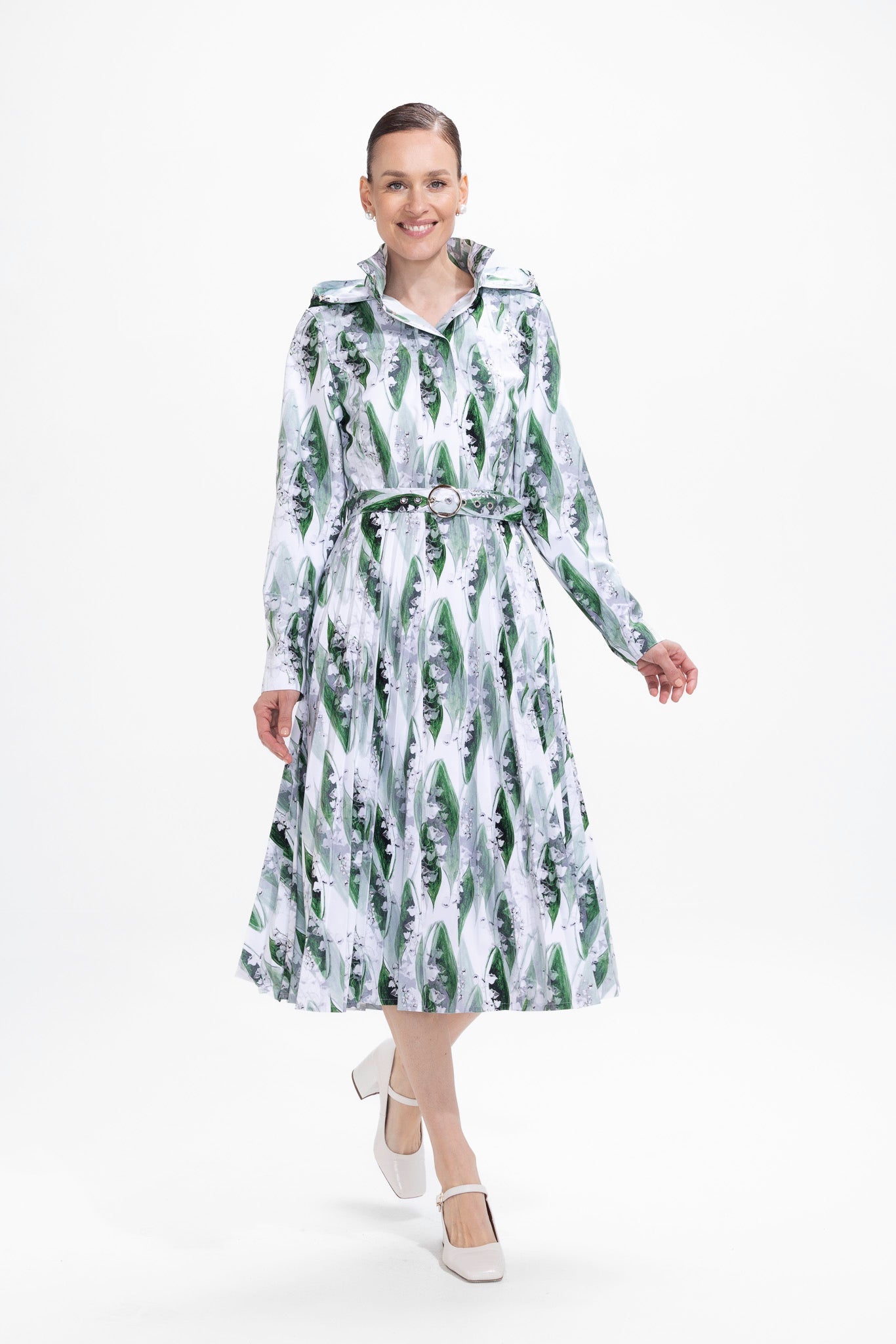rainsisters-coat-whispers-of-may-waterproof-white-floral-in-motion.jpg?v=1779058193